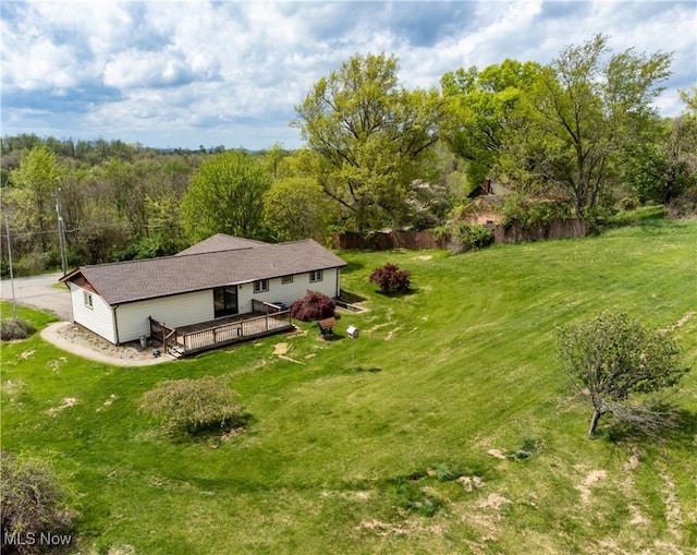 birds eye view of property with a wooded view