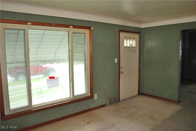entrance foyer featuring baseboards and visible vents