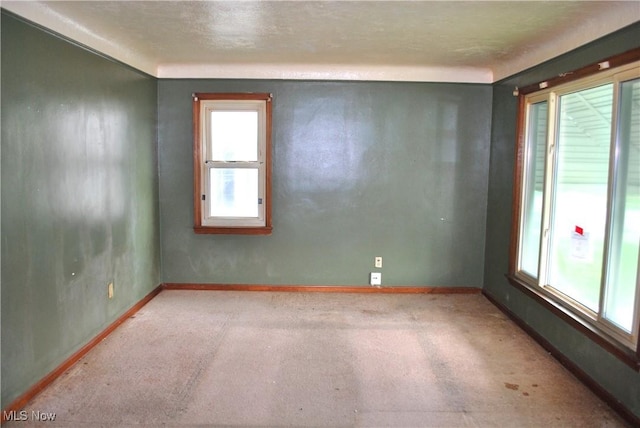 empty room featuring baseboards