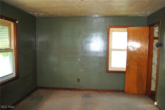 empty room with baseboards