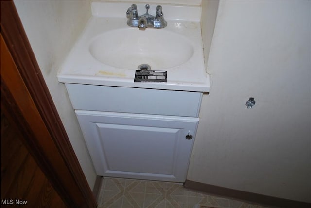 details featuring baseboards and vanity