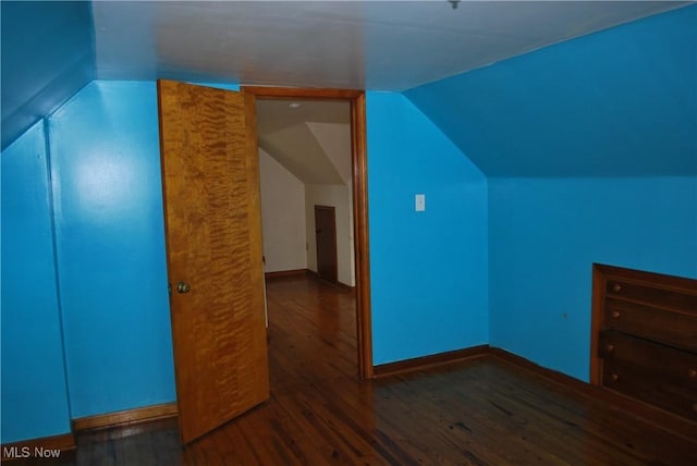 bonus room with baseboards, wood finished floors, and lofted ceiling