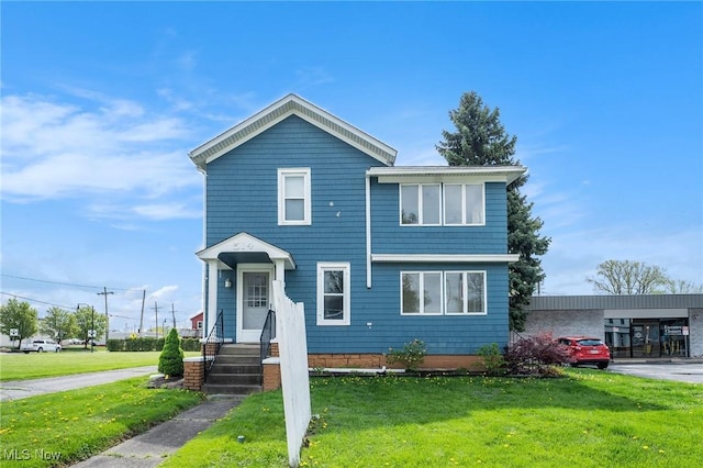 view of front of home featuring a front lawn