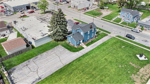 birds eye view of property with a residential view
