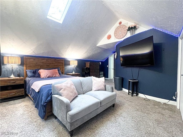 carpeted bedroom with baseboards, a textured ceiling, and lofted ceiling