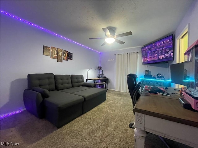 office space with carpet floors, a textured ceiling, and ceiling fan