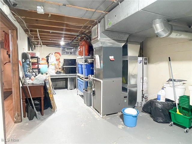 unfinished below grade area with heating unit and water heater