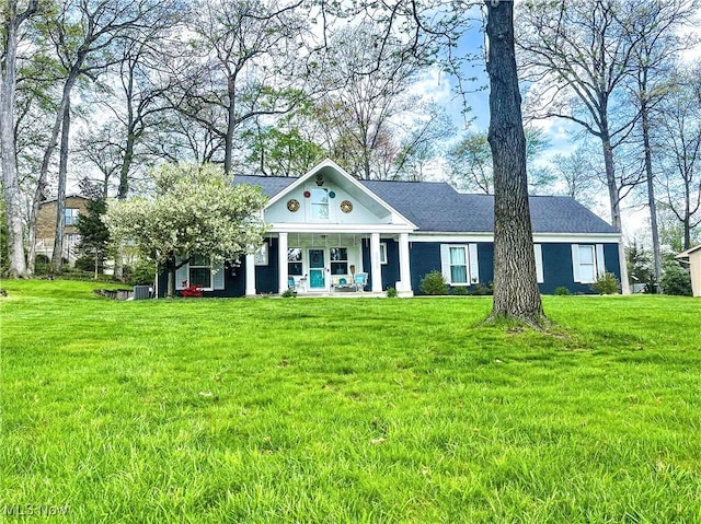 neoclassical / greek revival house with covered porch, central AC, and a front yard