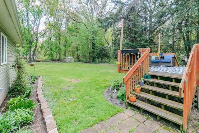 7599 Fairview Ave, Mentor, OH 44060 - view of yard featuring a wooden deck, an outbuilding, and a shed
