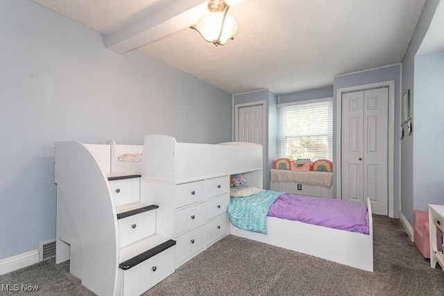 7599 Fairview Ave, Mentor, OH 44060 - bedroom featuring carpet floors, baseboards, two closets, and beam ceiling