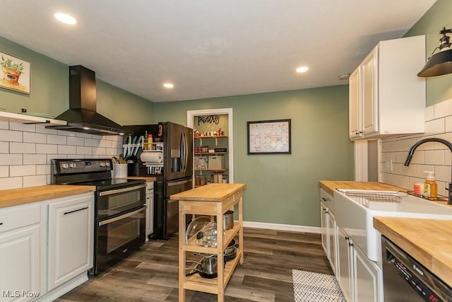 7599 Fairview Ave, Mentor, OH 44060 - kitchen with butcher block counters, dishwashing machine, tasteful backsplash, exhaust hood, and double oven range
