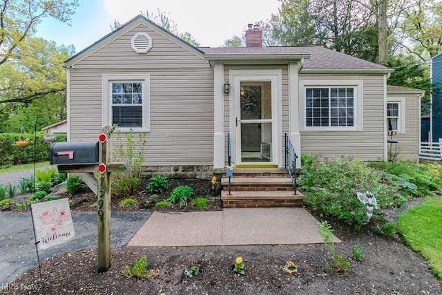 7599 Fairview Ave, Mentor, OH 44060 - bungalow-style house with entry steps and a chimney