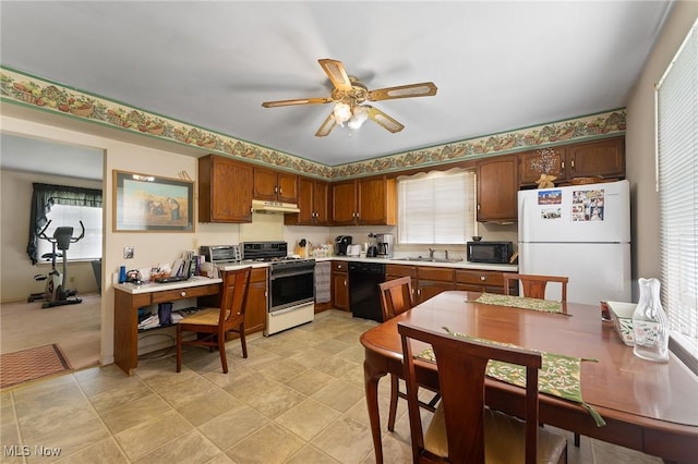 1536-1548 Montclair St NE, Warren, OH 44483 - kitchen featuring a sink, light countertops, a ceiling fan, under cabinet range hood, and black appliances