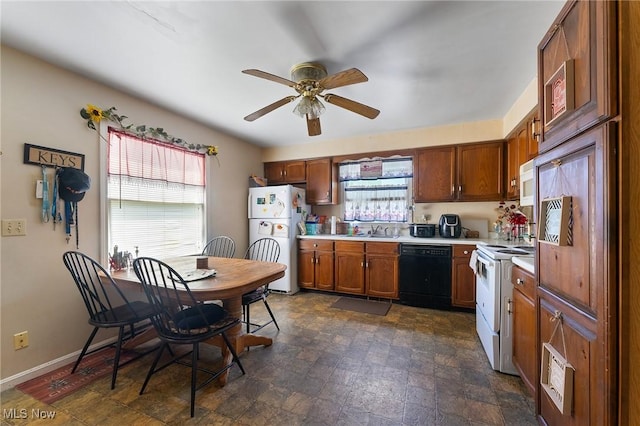 1536-1548 Montclair St NE, Warren, OH 44483 - kitchen with a sink, white appliances, light countertops, plenty of natural light, and a ceiling fan