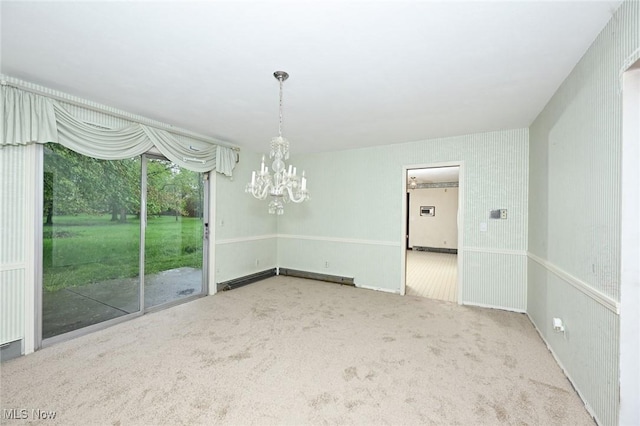 unfurnished dining area with a baseboard radiator, carpet, and an inviting chandelier