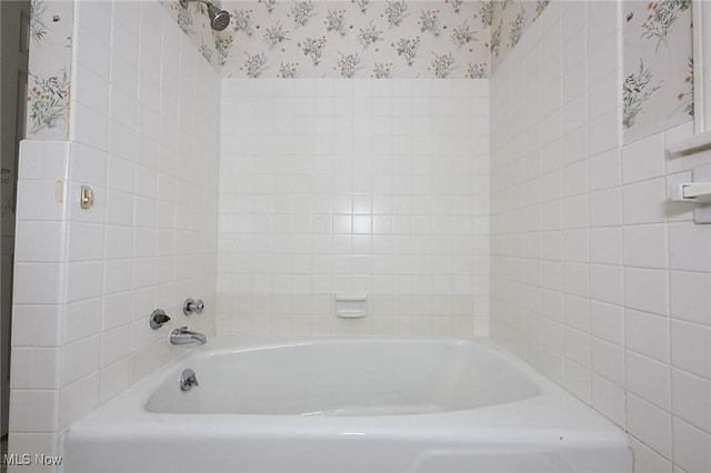 full bathroom featuring wallpapered walls and a tub to relax in