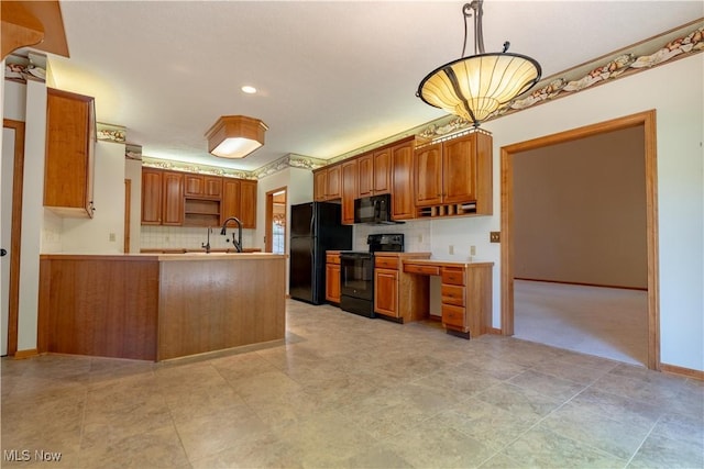 kitchen featuring a peninsula, hanging light fixtures, brown cabinetry, black appliances, and light countertops