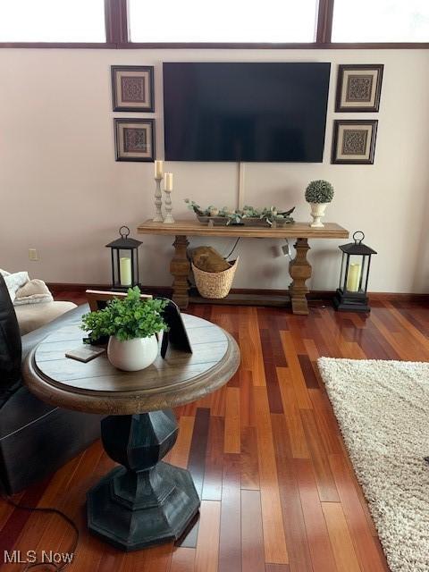 living room with wood finished floors and baseboards