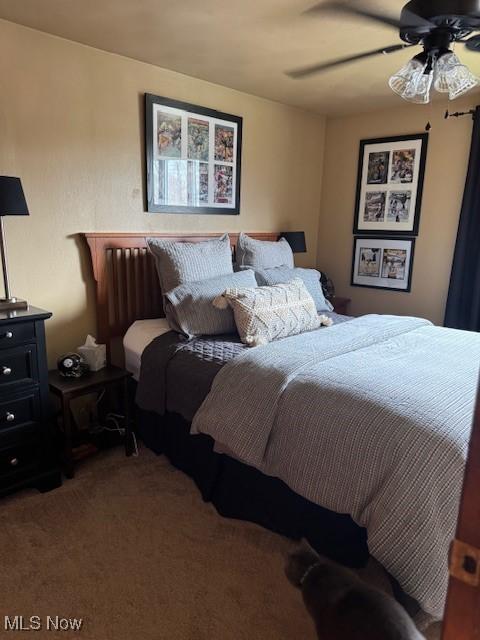 bedroom featuring carpet flooring and a ceiling fan