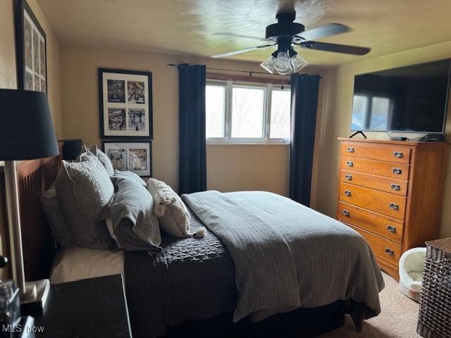 bedroom featuring carpet flooring and a ceiling fan