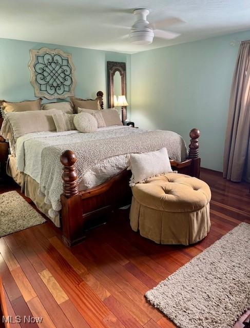bedroom with ceiling fan and wood finished floors