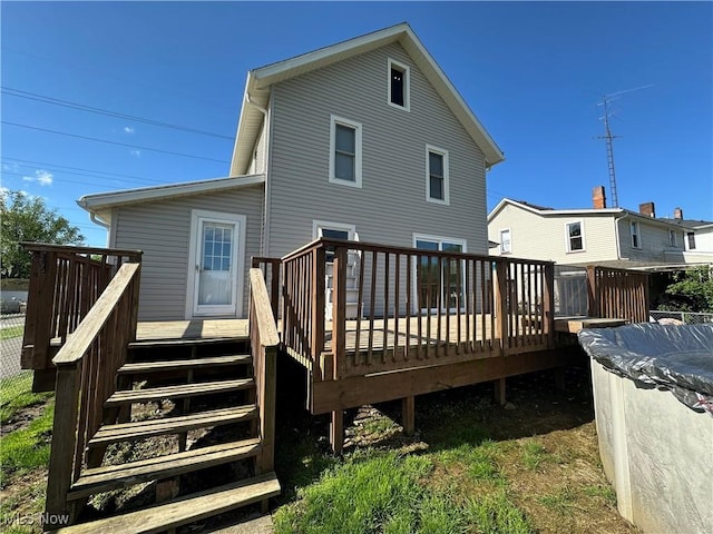 1905 Pine St SE, East Sparta, OH 44626 - back of property featuring stairway, a covered pool, and a deck