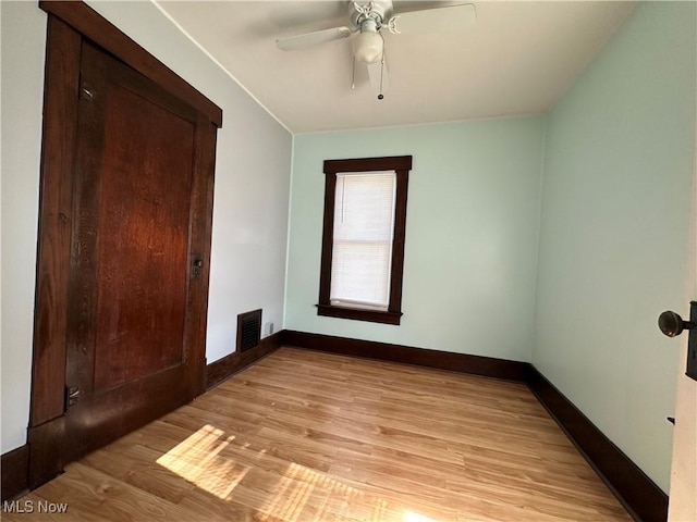 1905 Pine St SE, East Sparta, OH 44626 - unfurnished bedroom with a closet, baseboards, ceiling fan, visible vents, and light wood-type flooring