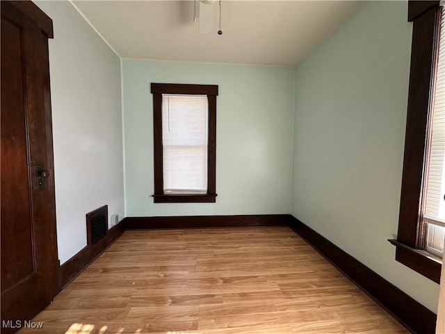 1905 Pine St SE, East Sparta, OH 44626 - empty room featuring light wood finished floors, visible vents, and baseboards