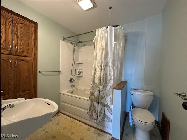 1905 Pine St SE, East Sparta, OH 44626 - bathroom with toilet, baseboards, tile patterned floors, and shower / bath combination with curtain