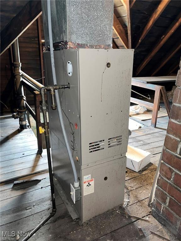 utility room with heating unit