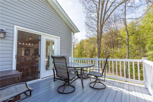 wooden deck with outdoor dining area