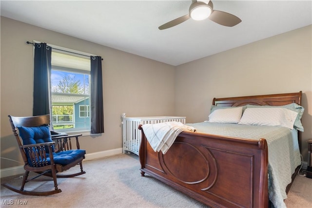 bedroom featuring carpet flooring, baseboards, and a ceiling fan