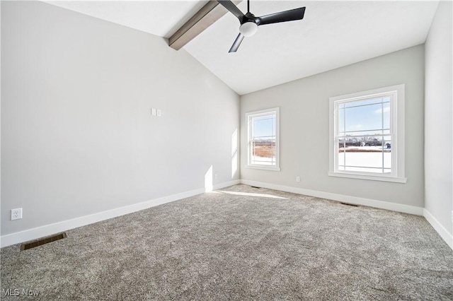 carpeted empty room with ceiling fan, lofted ceiling with beams, baseboards, and visible vents