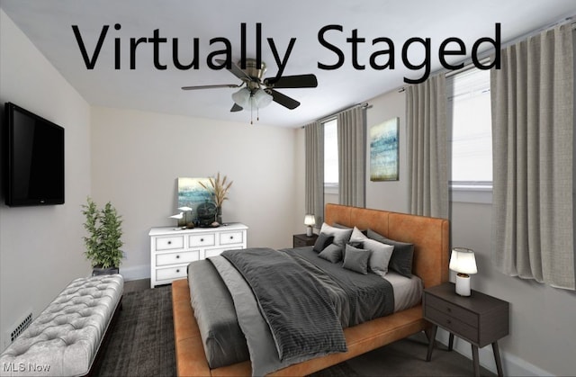 bedroom featuring baseboards, a ceiling fan, and visible vents