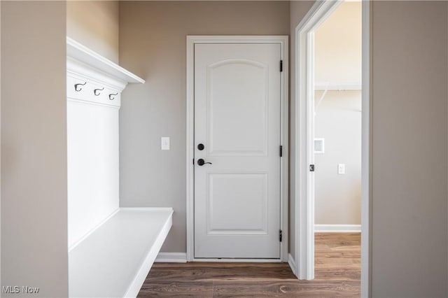 mudroom with baseboards and wood finished floors
