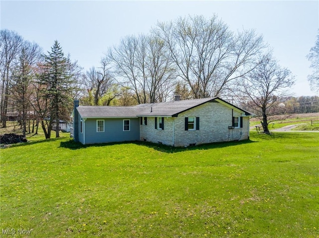 4820 Alabama Ave SW, Navarre, OH 44662 - back of house featuring a lawn and a chimney