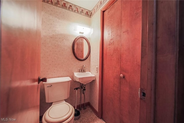 4820 Alabama Ave SW, Navarre, OH 44662 - half bath with a sink, toilet, and wallpapered walls