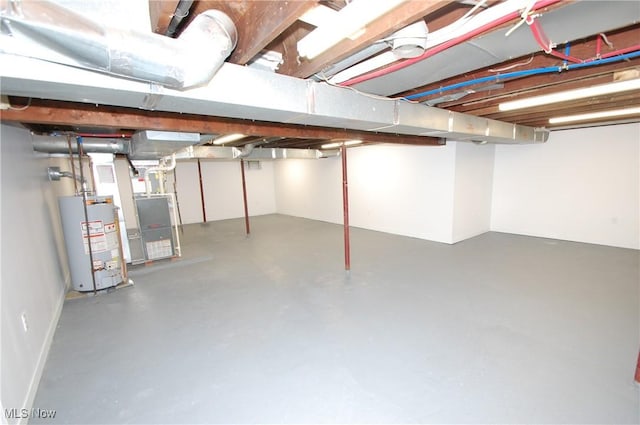 unfinished below grade area with water heater and heating unit