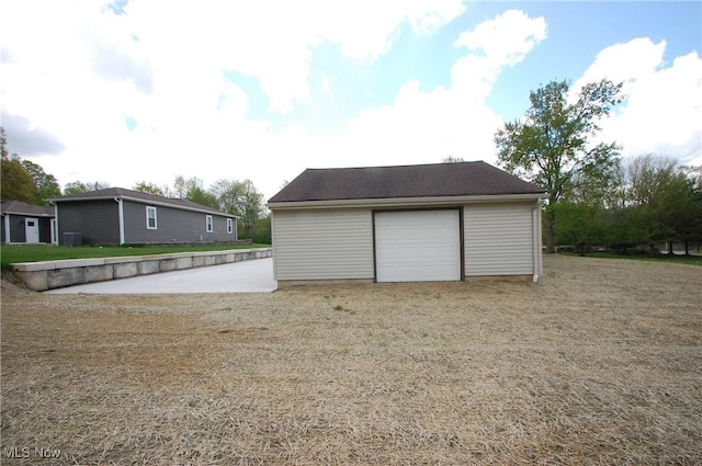 detached garage featuring central AC