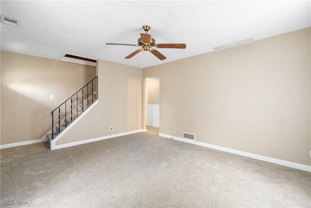 unfurnished living room with visible vents, ceiling fan, and carpet floors