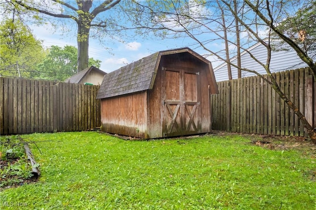 view of shed featuring a fenced backyard