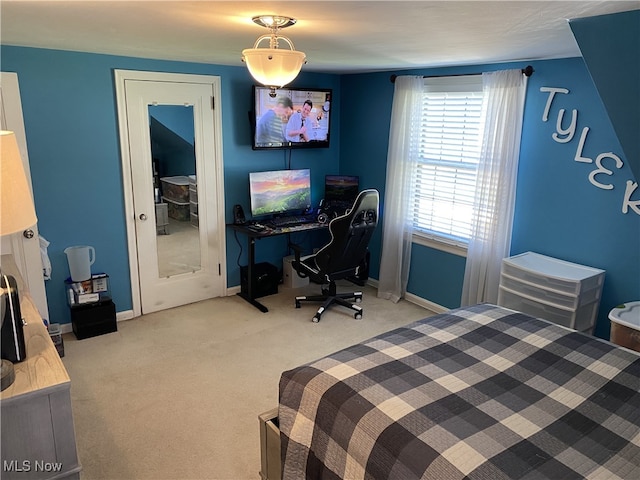 bedroom with baseboards and carpet flooring