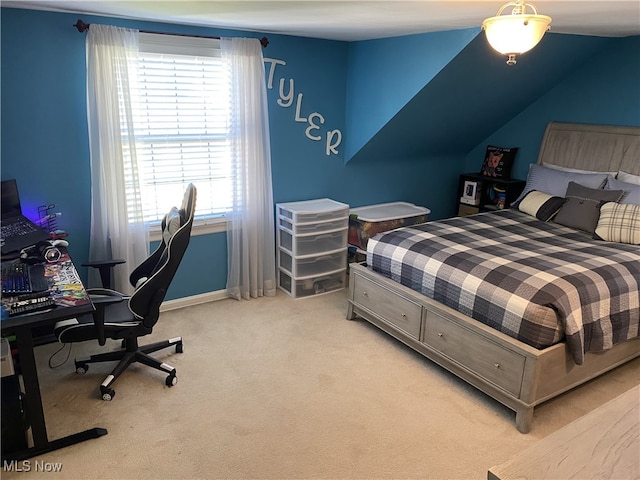 bedroom featuring light colored carpet, multiple windows, and baseboards