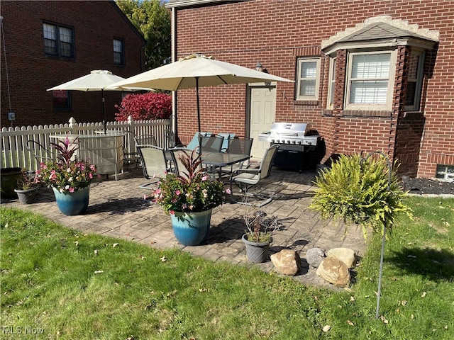 exterior space with fence and grilling area