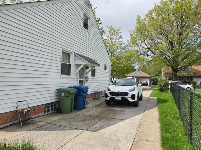 view of side of home with fence
