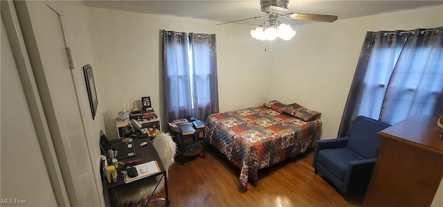 bedroom with ceiling fan and wood finished floors