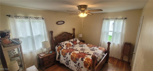 bedroom featuring ceiling fan and dark wood-style floors