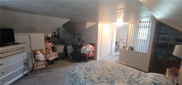 carpeted bedroom featuring vaulted ceiling