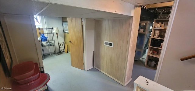 corridor with visible vents and finished concrete floors
