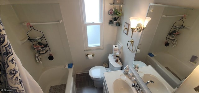bathroom with toilet, vanity, and shower / bath combination with curtain